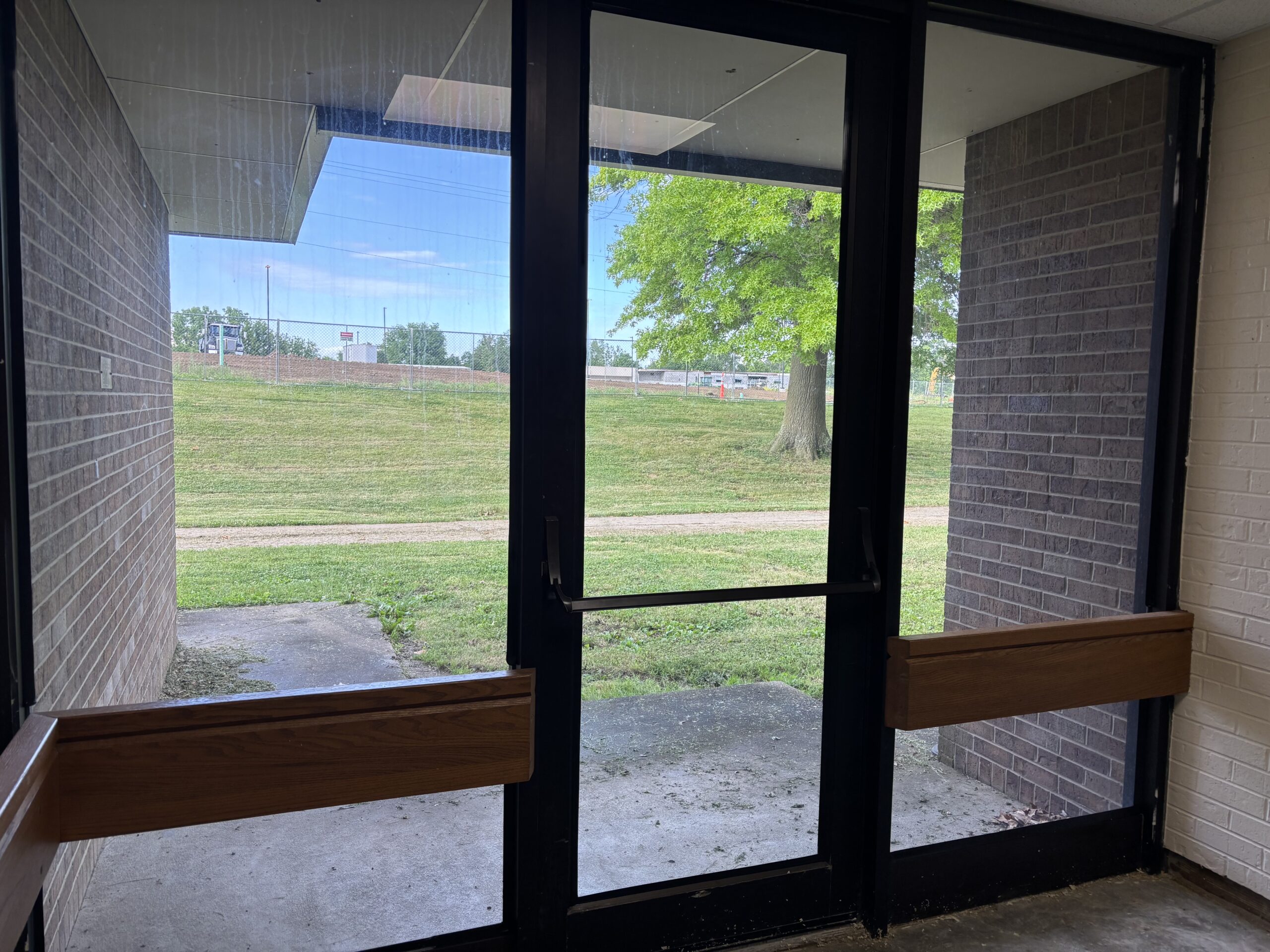 School side door and side lights featuring 16 mil RiotLite security film with attachment for added safety
